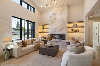 Modern living room with marble fireplace and large windows and offwhite light