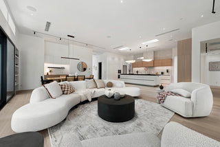 Modern living room with white furniture and neutral decor