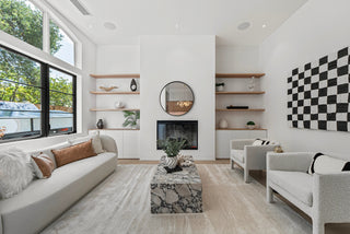 Modern living room with white walls, gray sofa, and decorative elements nice outlooking  window