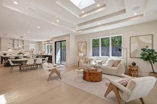 Modern living room wooden floor, and neutral decor ,with white walls door and window
