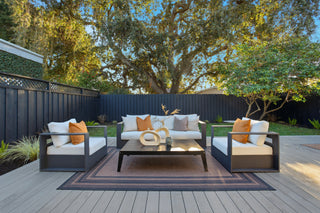 Outdoor patio set with cushions on a wooden deck
