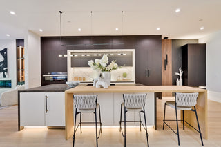 Modern kitchen with wooden island and bar stools