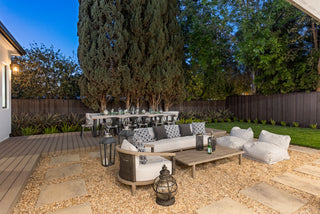 Outdoor patio with furniture and decor in a backyard setting