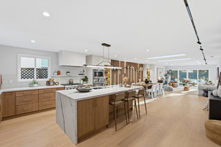 Modern kitchen with marble island and wooden cabinets
