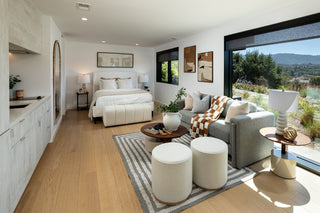 Modern bedroom with a view of a scenic landscape