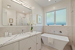  bathroom with white vanity,  and cabinets nice looking desing and view