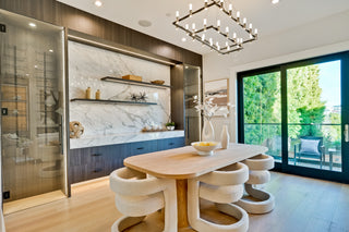 current kitchen with a dining table and chairs in a well-lit room.