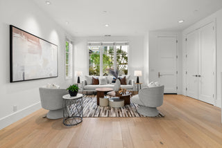 Modern living room with gray sofa, chairs, and a coffee table