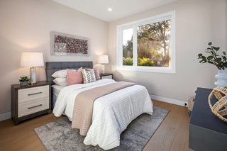 wonderful Neatly arranged bedroom with a bed, nightstands, and decor.